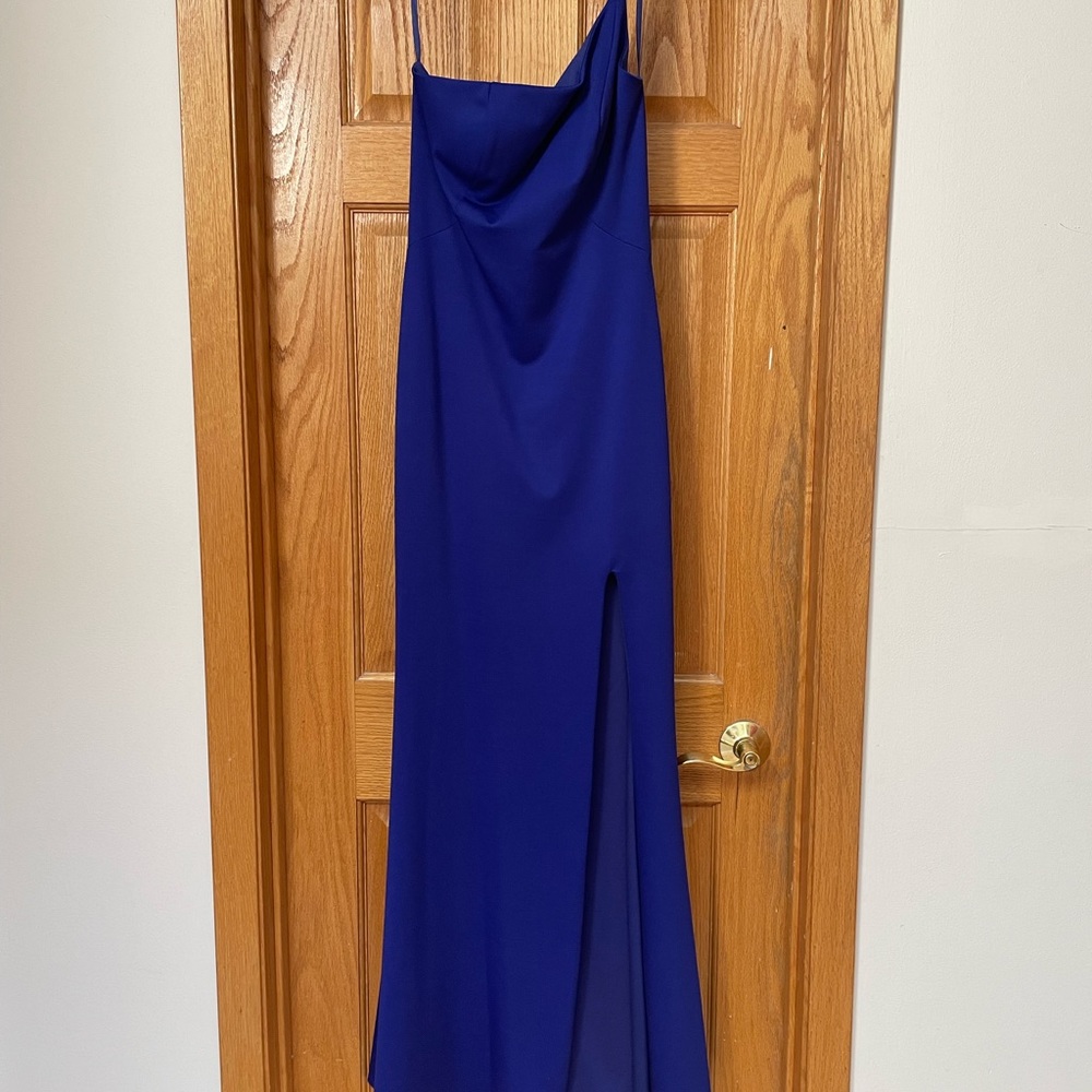 La Femme fitted floor length dress with left leg slit and left shoulder strap.